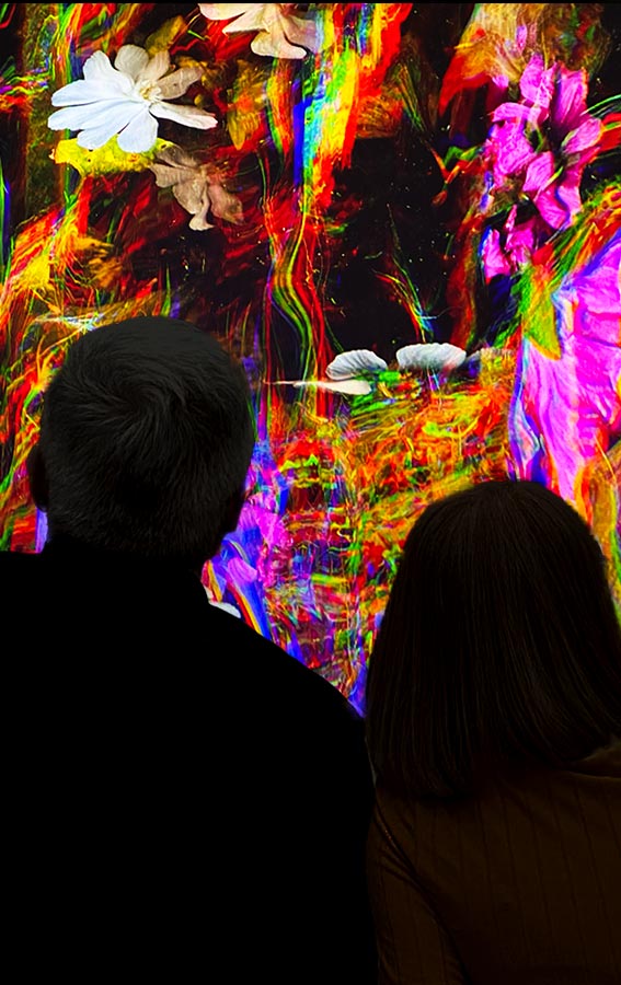 Woman and man watch Katherine Melançon artwork To Soften our Fall