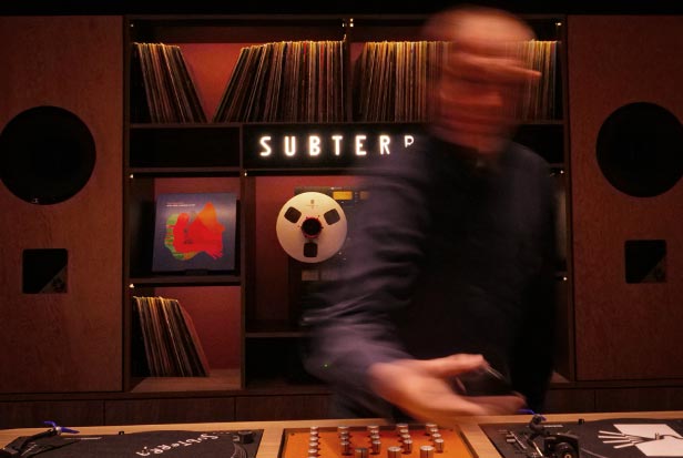 Subterra vinyl DJ with sound system in the background